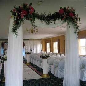 fwthumbFloral swagged entrance to the aisle.jpg